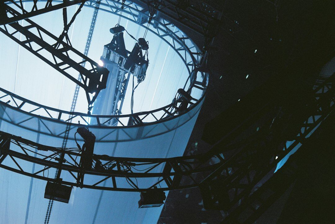 Technicians setting up a stage lighting rig